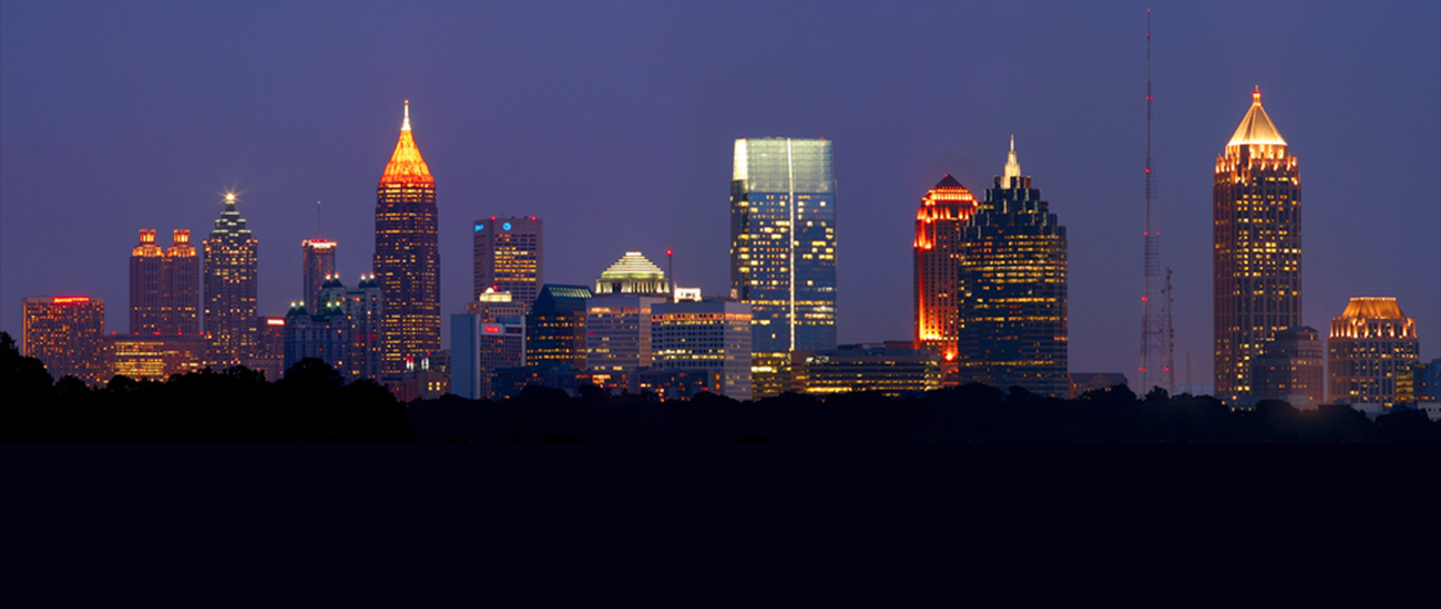 Photograph of Atlanta skyline in the night.